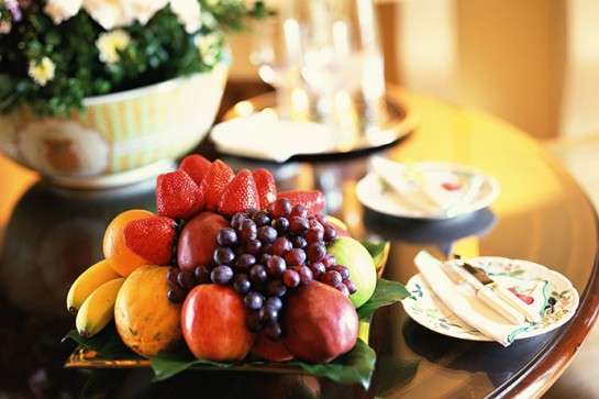 Fruit and plates on table