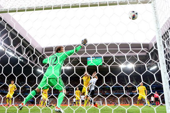 LILLE, FRANCE - JUNE 12:  Shkodran Mustafi of Germany heads the ball to score his team's first goal past Andriy Pyatov of Ukraine during the UEFA EURO 2016 Group C match between Germany and Ukraine at Stade Pierre-Mauroy on June 12, 2016 in Lille, France.  (Photo by Alexander Hassenstein/Getty Images)