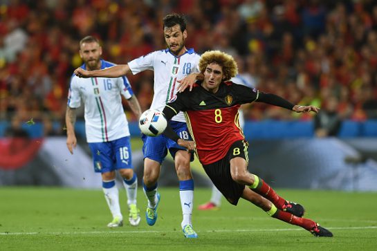 LYON, FRANCE - JUNE 13: Marouane Fellaini of Belgium and Marco Parolo of Italy compete for the ball during the UEFA EURO 2016 Group E match between Belgium and Italy at Stade des Lumieres on June 13, 2016 in Lyon, France.  (Photo by Claudio Villa/Getty Images)