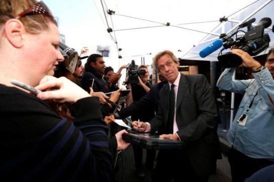 Actor Hugh Laurie signs autographs after unveiling his star on the Hollywood Walk of Fame in Los Angeles, California U.S., October 25, 2016. REUTERS/Mario Anzuoni - RTX2QFSB