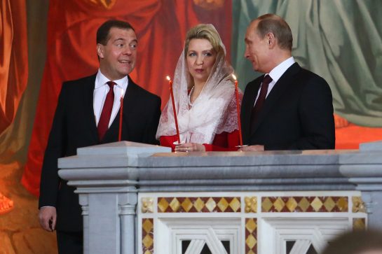 May 5, 2013 - Moscow, Russia - May 05,2013. Pictured: l-r Russia's Prime Minister Dmitry Medvedev, Medvedev's spouse Svetlana Medvedeva and Russia's President Vladimir Putin attend Orthodox Easter church service in the Christ the Savior Cathedral of Moscow.