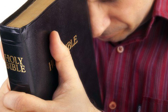 Man-Praying-Holding-The-Bible-Shutterstock-800x430