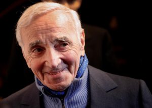 French singer Charles Aznavour, who stole the hearts of millions with decades of haunting love songs, died October 1 aged 94. The singer, who sold more than 100 million records in 80 countries, began his career peddling his words and music to the Paris boulevardiers of the 40s and 50s - Edith Piaf, Maurice Chevalier, Charles Trenet. But it became evident that Aznavour himself best interpreted the bittersweet emotions of such songs as "Hier Encore" (Yesterday When I Was Young), "Apres l'Amour" (After Love) and "La Boheme." Others were "She" and "Formidable." Sometimes described as France's Frank Sinatra, Aznavour was born in Paris in 1924 to Armenian parents - his birth name Shahnour Aznavourian. In his autobiography, "Aznavour by Aznavour," he recalls that after a period trying to play the role of a tough guy, he was goaded one evening into climbing on the bandstand to sing. "There, I had a revelation. I saw that the girls looked at me much more, their eyes moist and their lips apart, than when I played a terror ... I was only 15 or 16, but I understood," he wrote.

REUTERS/Christophe Ena/Pool