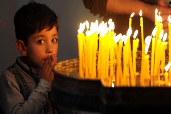 A boy stands next to candles as Holy Mass is celebrated at Etchmiadzin Cathedral – the mother church of the Armenian Apostolic Church – in Vagharshapat, Armenia. The biggest saint-making service is history is due to take place outside the cathedral on Wednesday 23 April when the 1.5 million victims of the Armenian genocide will be canonised. The 100th anniversary of the genocide is on Friday 24 April.

PICTURE TAKEN ON SUNDAY 19 APRIL 2015